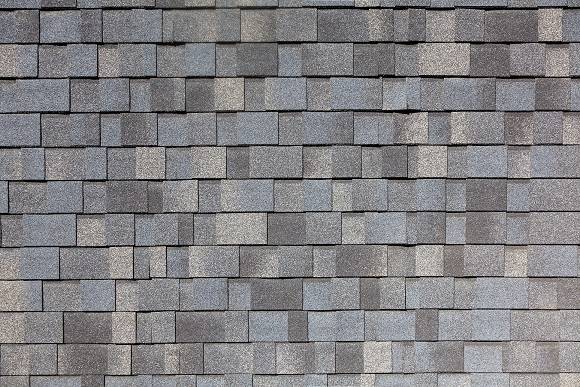 asphalt shingles laid out next to each other in rows